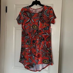 Bobby Brooks high low medium tunic top in a printed pattern.